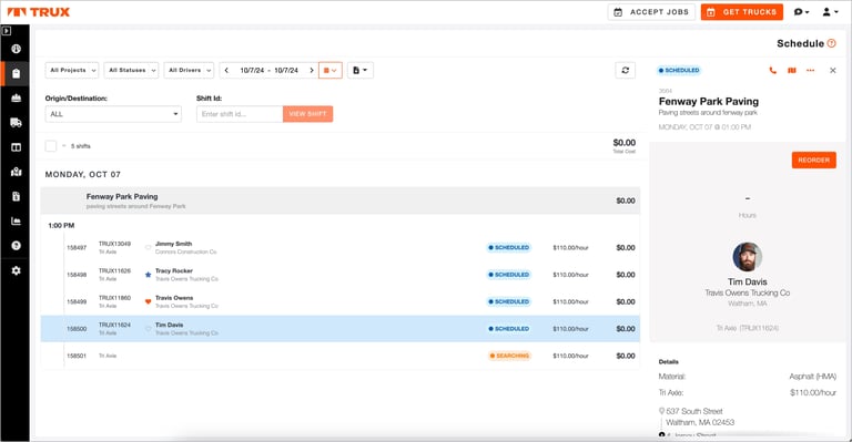 The image shows a Trux dispatch screen for "Fenway Park Paving" on Monday, October 7th. Several drivers, including Jimmy Smith, Tracy Rocker, and Tim Davis, are scheduled with Tri Axle trucks at $110/hour. A sidebar shows details for Tim Davis, including his company, rate, and a "Reorder" button.